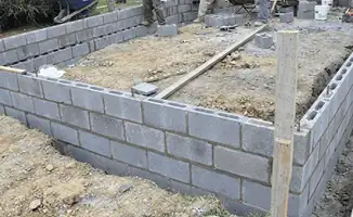 Professionals building a foundation with blocks in Boise, ID