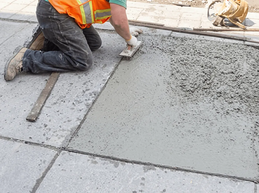 Professional repairing a concrete floor in Boise, ID