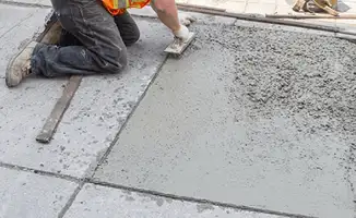 Professional repairing a concrete floor in Boise, ID